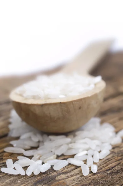 Rice in the wooden spoon — Stock Photo, Image