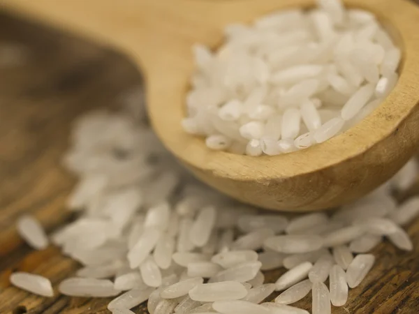 Rice in the wooden spoon — Stock Photo, Image