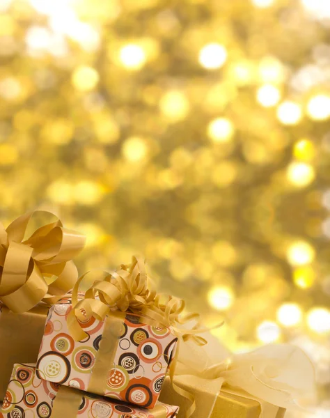 Plenty of gifts over shiny background — Stock Photo, Image