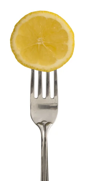 Кусок лимона на вилке — стоковое фото