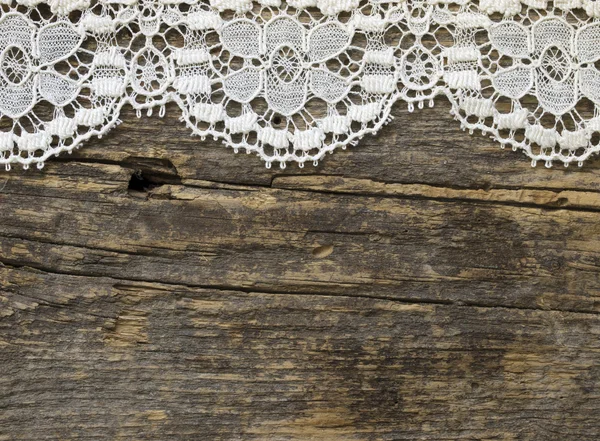 Vackra gamla mode spetsar på trä bakgrund — Stockfoto
