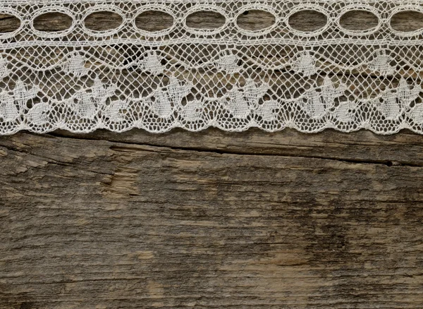 Gyönyörű régi divat csipke a fából készült háttér — Stock Fotó