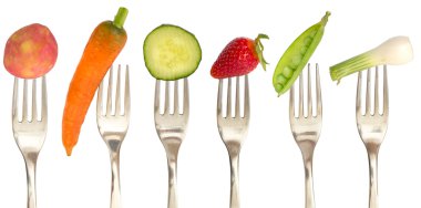 Vegetables and fruits on the collection of forks, diet concept clipart
