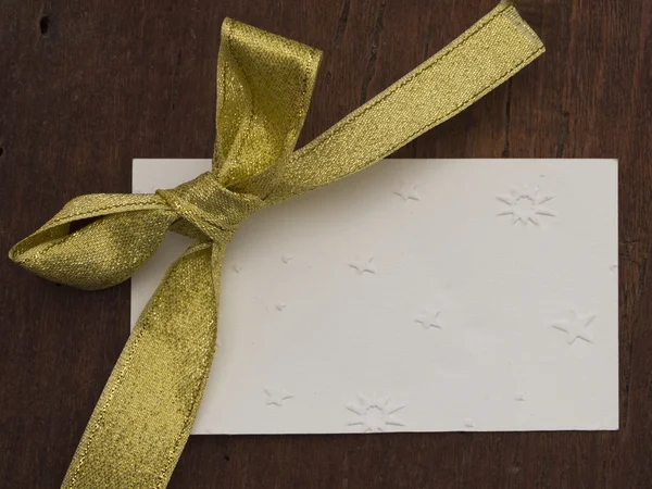 Blank paper note with beautiful silk bow — Stock Photo, Image