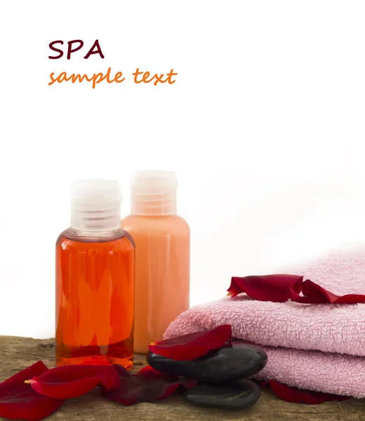 Spa bottles with petals — Stock Photo, Image