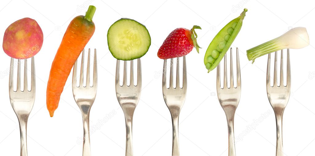 Vegetables and fruits on the collection of forks, diet concept
