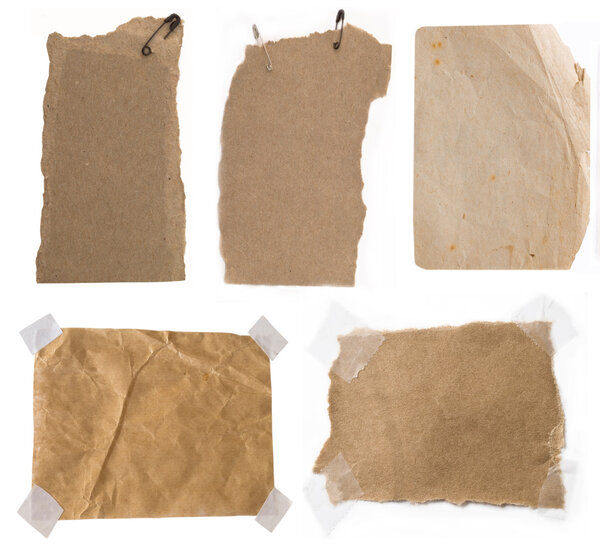 Collection of cardboard corrugated paper sheets and tags with strings