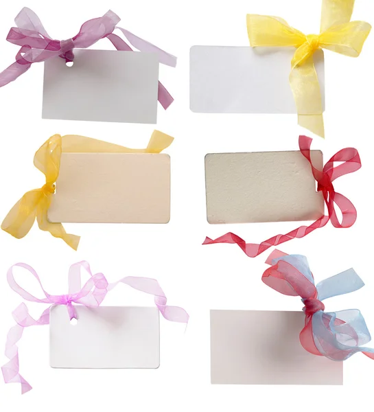Tags with beautiful colored ribbons — Stock Photo, Image