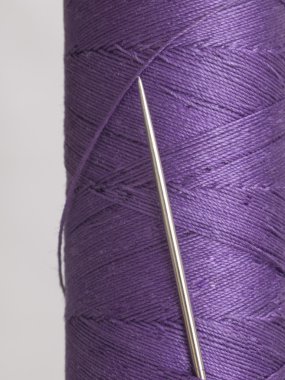 Needle in violet bobbin clipart