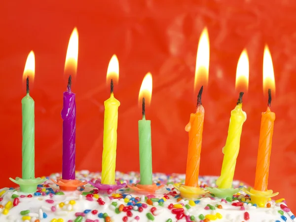 Burning candles on the cake — Stock Photo, Image