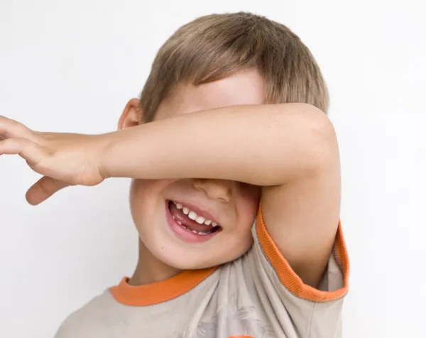Young boy with arm on his eyes — Stock Photo, Image