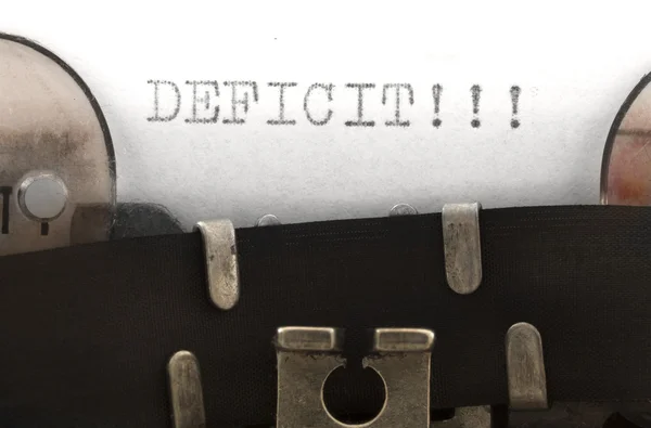 Дефицит, напечатанный на печатной машинке — стоковое фото