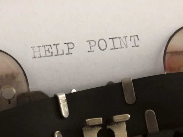 Hjälp punkt tryckt på skrivmaskinen — Stockfoto
