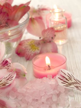 Spa arrangement with burning candles clipart