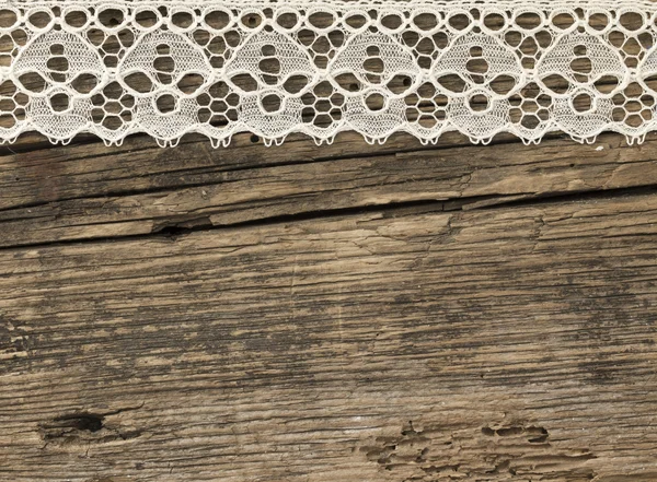 Koronki na drewniane tła — Zdjęcie stockowe