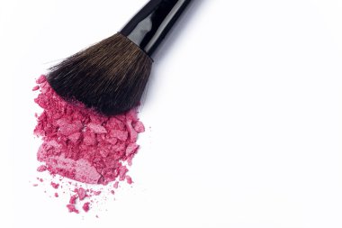 Close up of crushed blush with cosmetic brush clipart