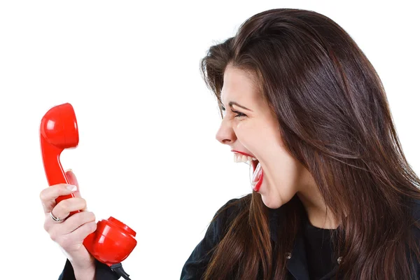 Woman screaming into telephone — Stock Photo, Image