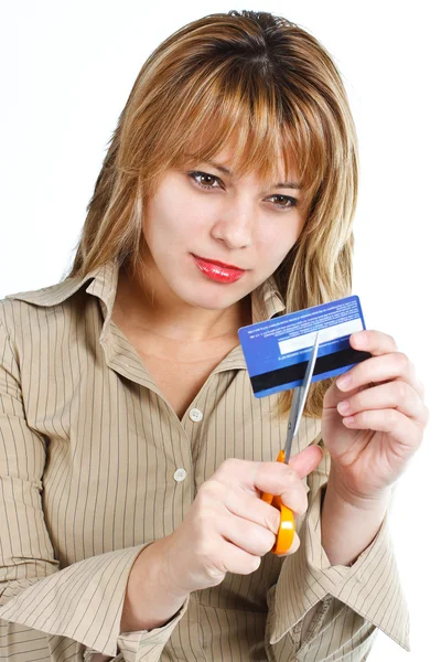 Mujer joven destruyendo tarjeta de crédito Fotos de stock