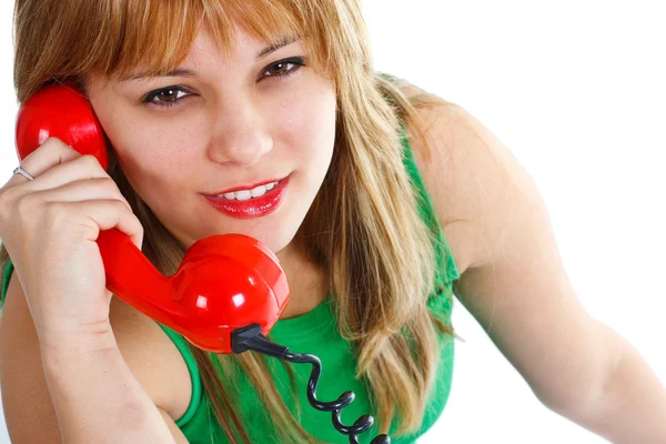 Молода жінка з червоним старим телефоном — стокове фото