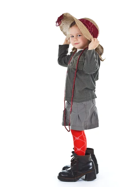 Little girl in big shoes — Stock Photo, Image
