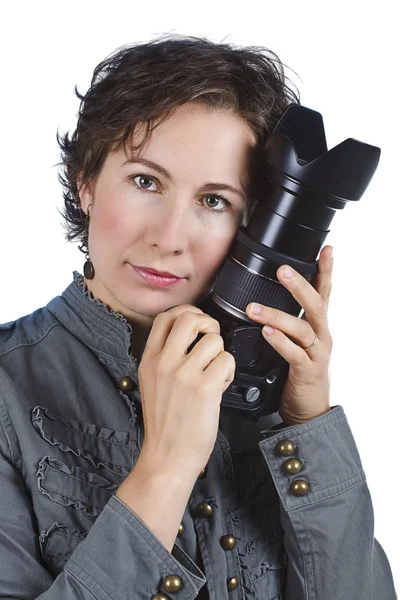 Attractive young woman holding a camera — Stock Photo, Image