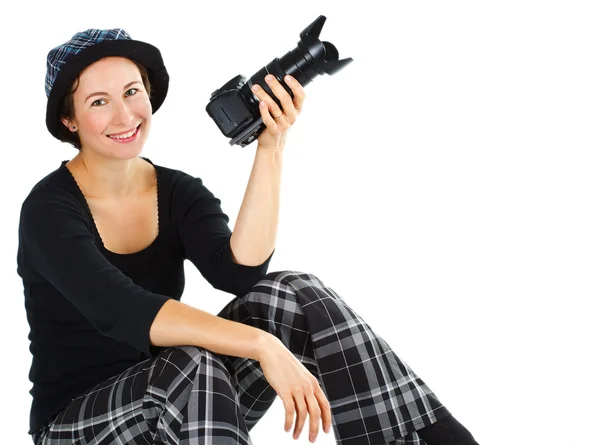 Smiling young woman with a camera — Stock Photo, Image