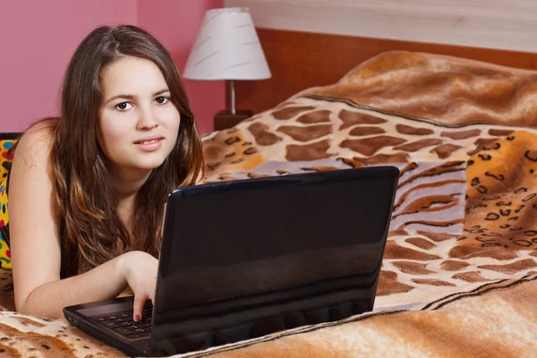 Teenage girl with laptop — Stock Photo, Image