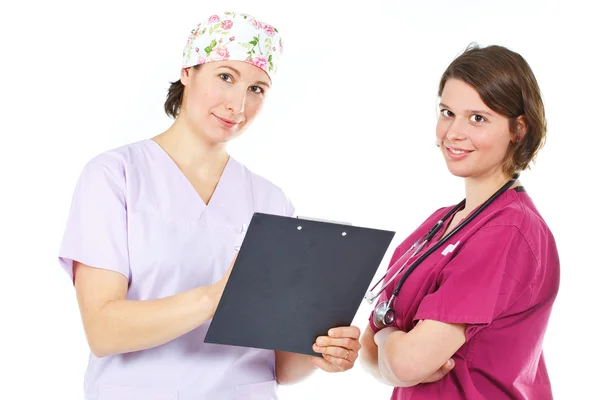Due giovani medici di sesso femminile consulenza — Foto Stock