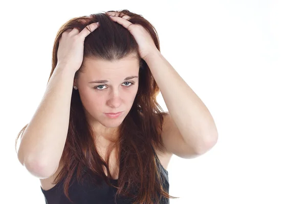 Missnöjd kvinna med händerna i håret — Stockfoto