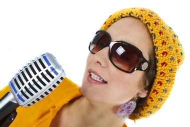 Portrait of female funky singer with microphone in hand clipart