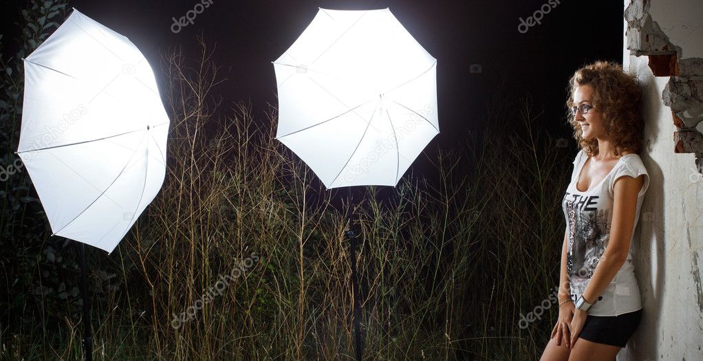 Girl facing studio lighting outdoors