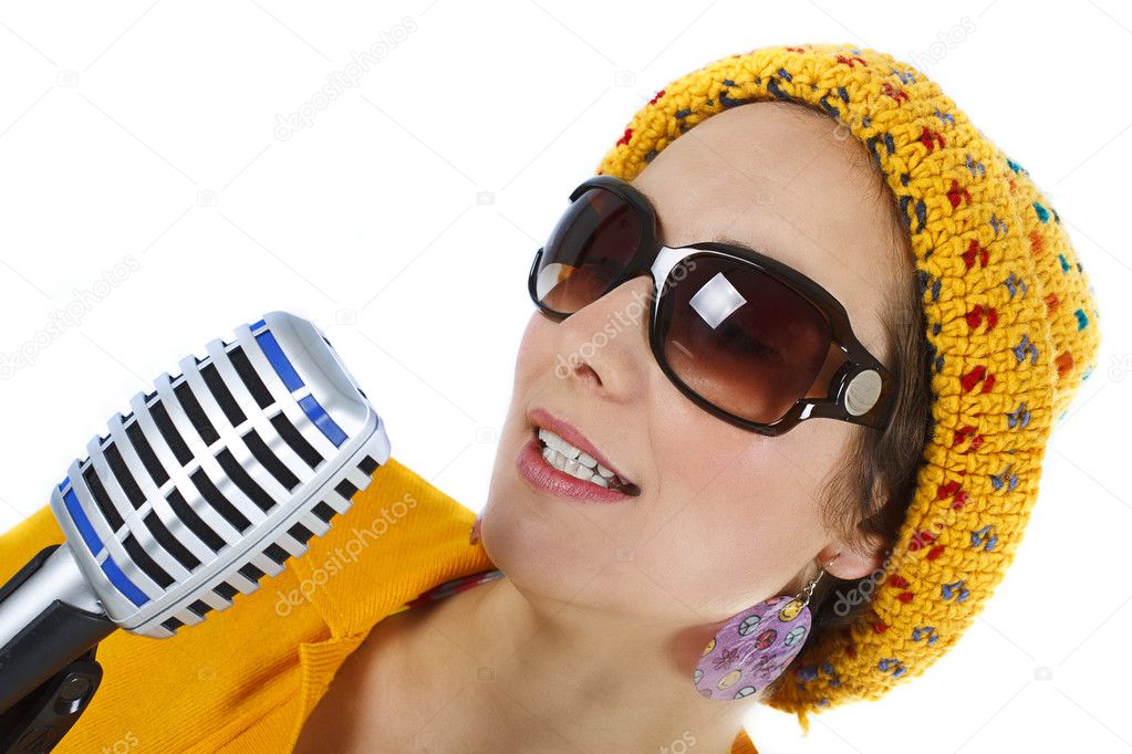 Portrait of female funky singer with microphone in hand