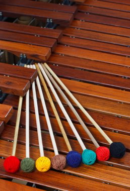 Mallets resting on marimba clipart