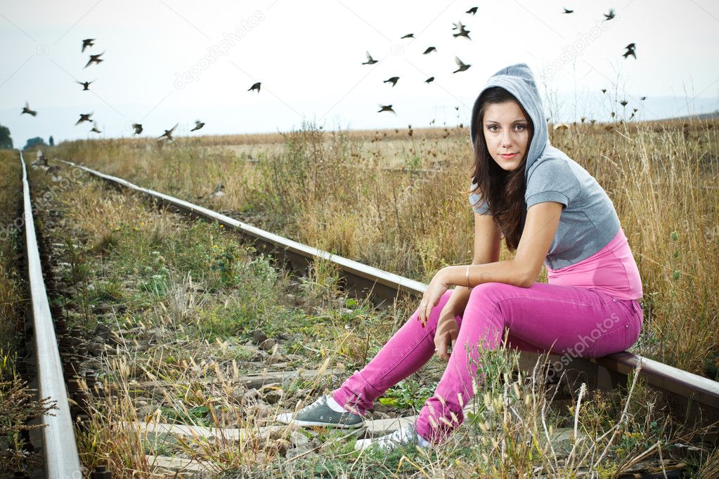 Girl sitting on railroad Stock Photo by ©kataijuditfoto 11446818