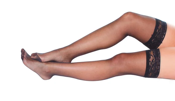 Sexy weibliche Beine mit Strümpfen — Stockfoto