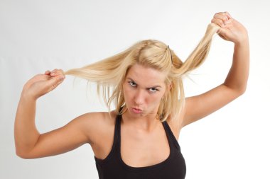 Blond woman making grimace clipart