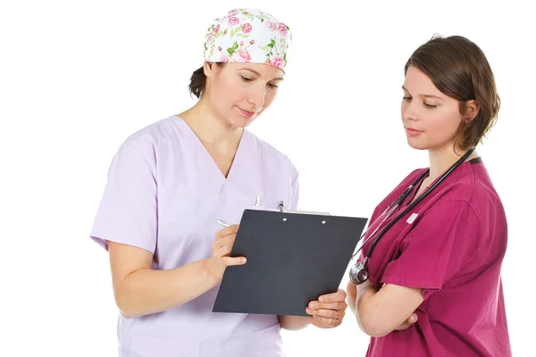 Two young female doctors consulting — Stock Photo, Image
