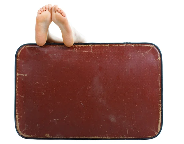 Old suitcase with naked female feet on top — Stock Photo, Image