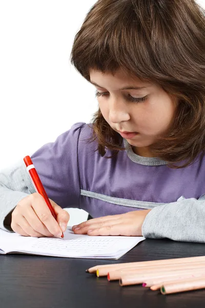 Cute little girl writing — Stock Photo, Image