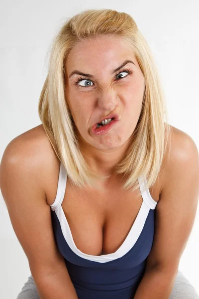 Young woman with grimace — Stock Photo, Image
