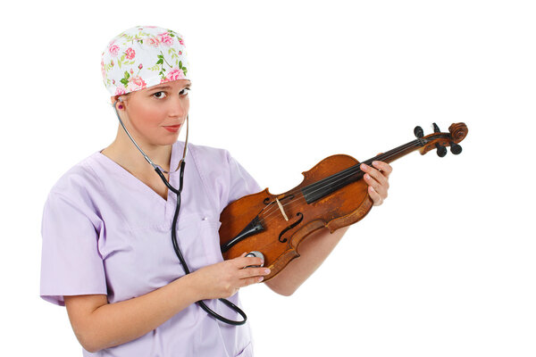 Female doctor examining a violin with stethoscope