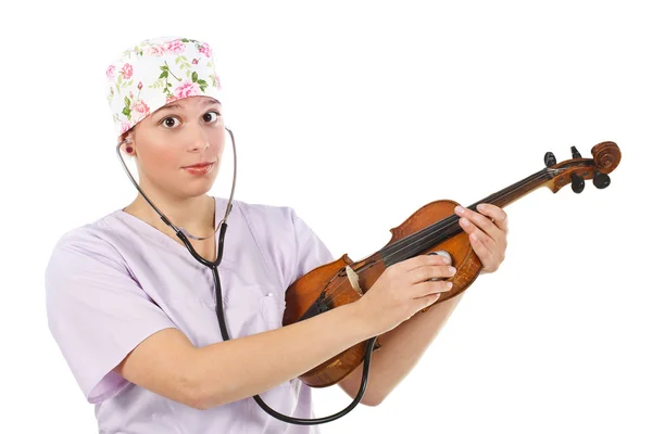 Female doctor examining violin — Stock Photo, Image