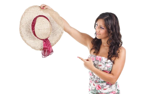 Krásná žena ukazující slaměný klobouk Royalty Free Stock Obrázky