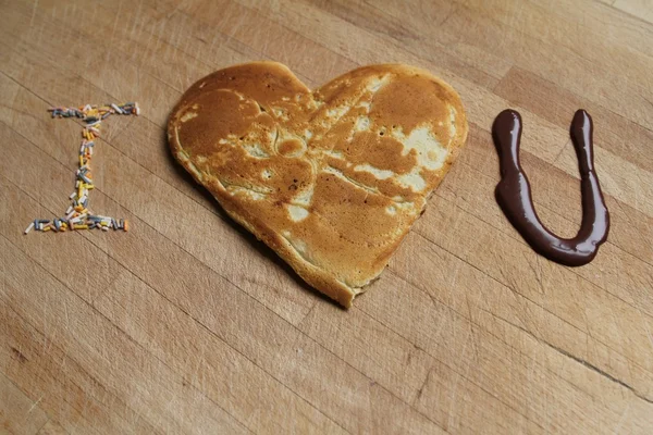 stock image I love you written with pancake and chocolate