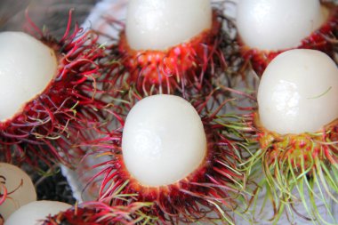 Red rambutan in plate