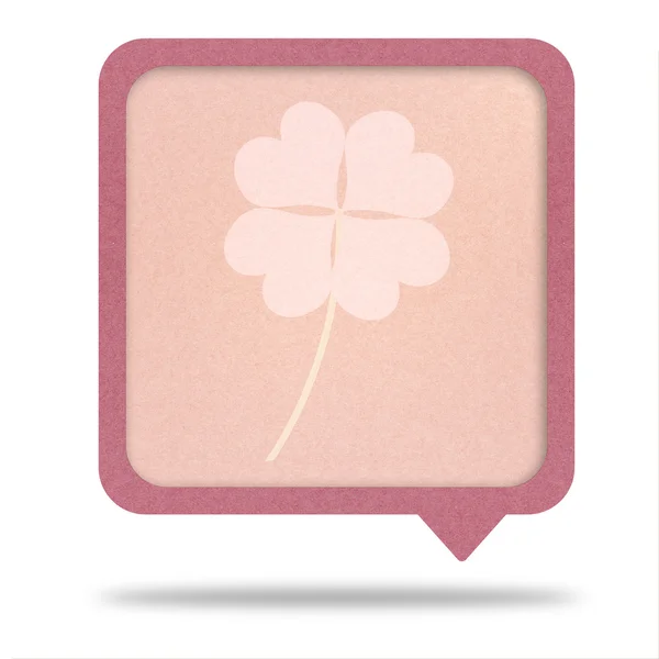 Clover with four leaves on recycle paper talk tag — Stock Photo, Image