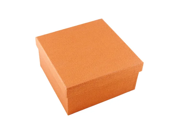 Orangefarbene Schachtel auf weißem Hintergrund — Stockfoto