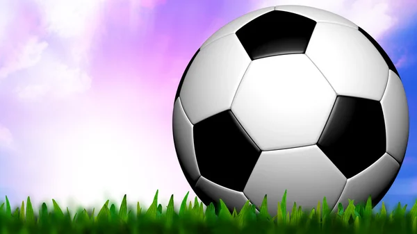 Футбол у зеленій траві над сутінковим небом — стокове фото