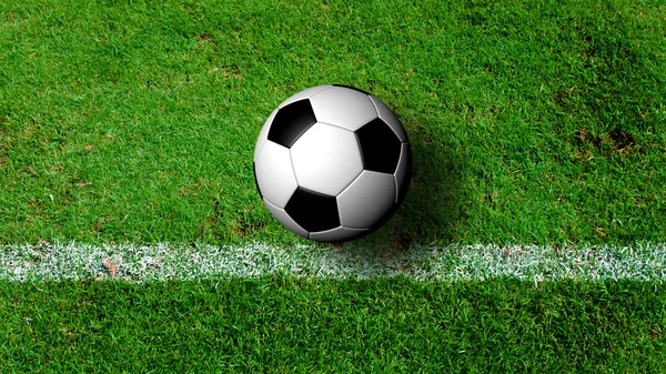 Voetbal op groen grasveld uit bovenaanzicht — Stockfoto