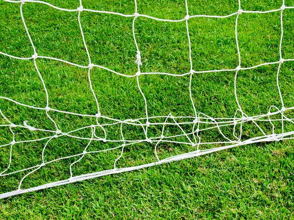 White football net and green grass — Stock Photo, Image